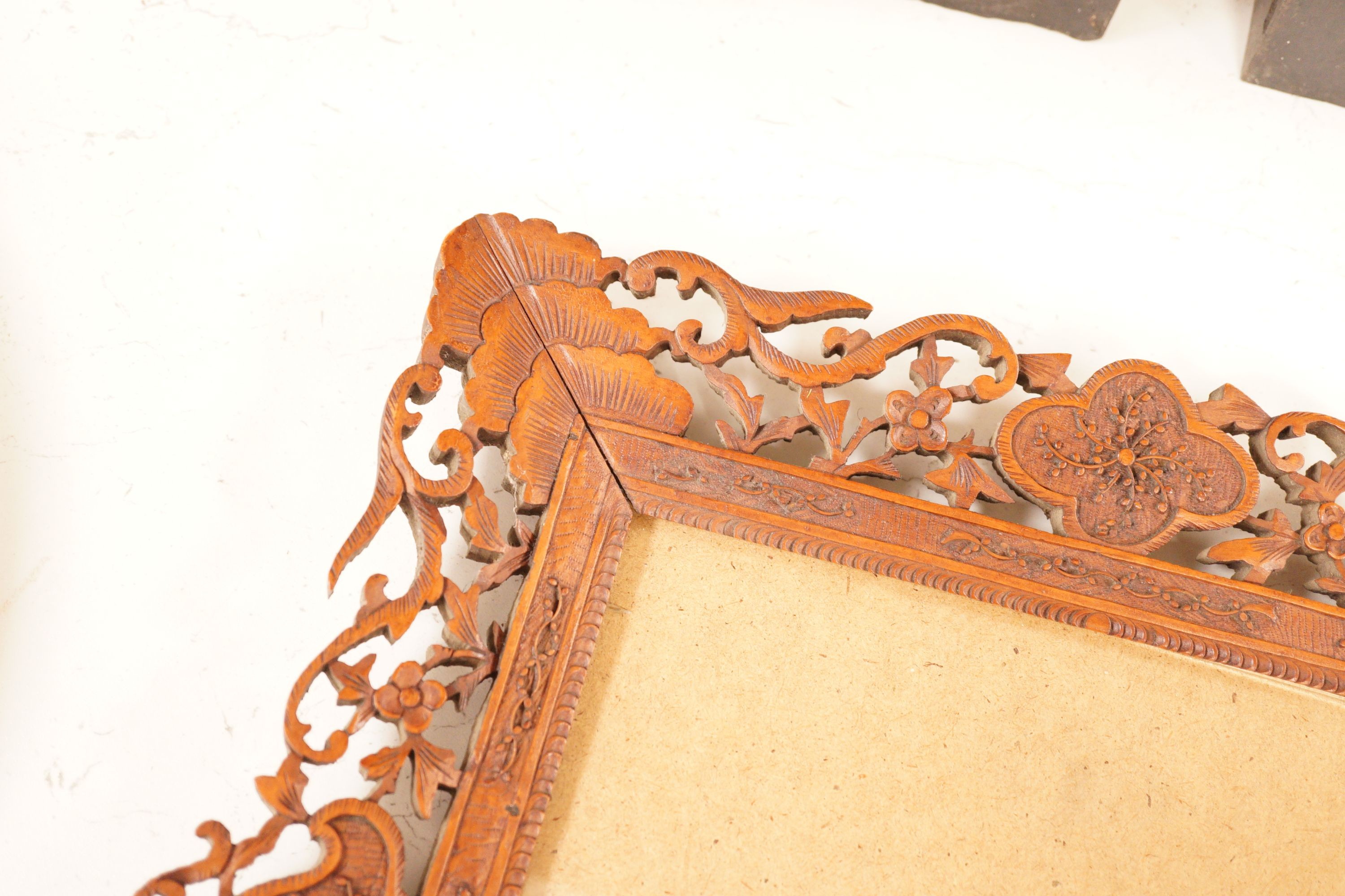 A Chinese carved sandalwood picture frame, 36x41 cm total
